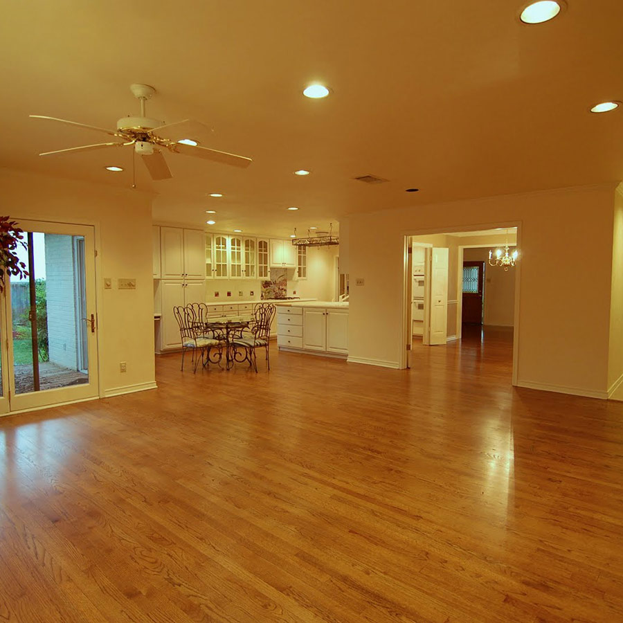 Image of cleaned, vacant house near kitchen and dining.